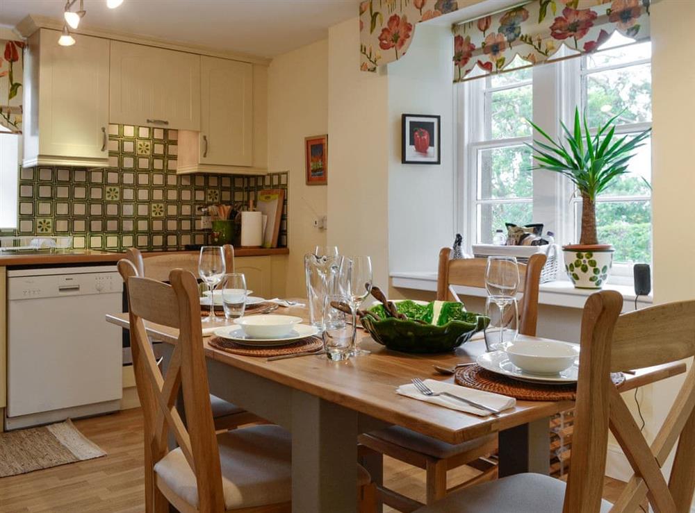 Spacious kitchen with dining area at Baldowrie Gate Lodge in Kettins, near Blairgowrie, Perthshire