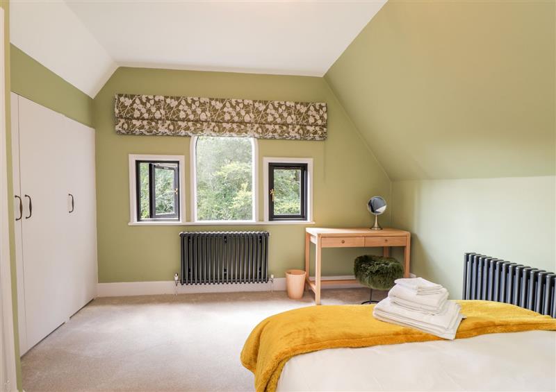 A bedroom in Baldwins Hill Cottage at Baldwins Hill Cottage, Loughton
