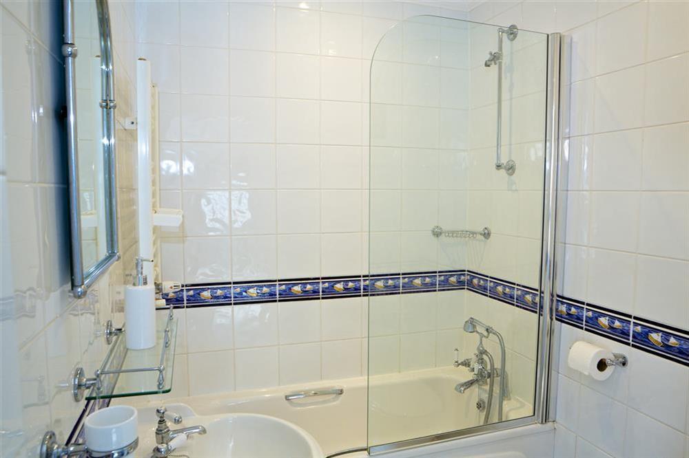 Family bathroom with shower over the bath at Balmoral House in , Dartmouth