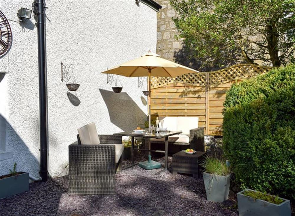 Sitting-out-area with garden furniture at Balvaig Cottage in Strathyre, near Callander, Perthshire