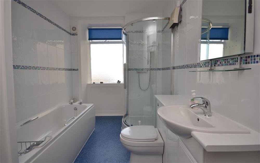 The large bathroom with bath and shower cubicle. at Banff in Lyme Regis