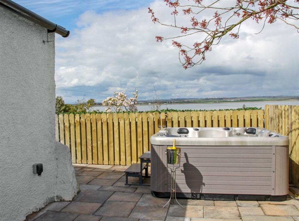 Inviting, private hot tub with wonderful sea views at Bank Cottage in Bowness-on-Solway, near Wigton, Cumbria
