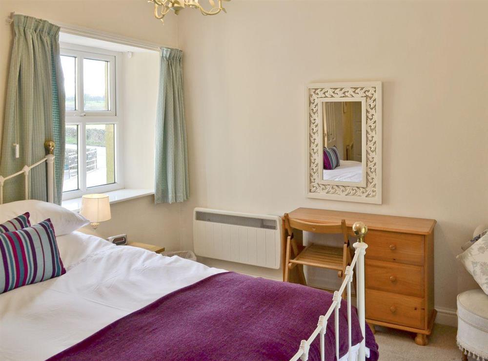 Comfortable master bedroom with smart TV at River View Cottage, 