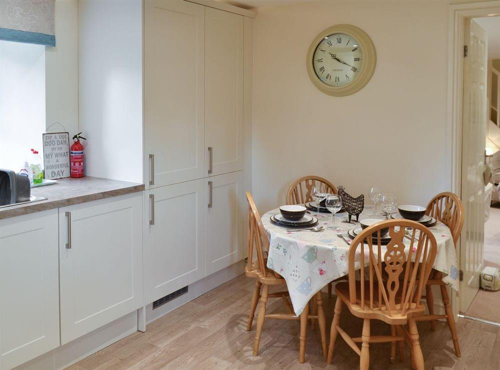 Intimate dining area in kitchen at River View Cottage, 