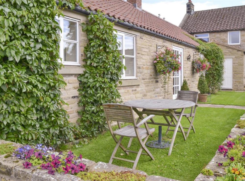 Lawned patio areas to front of property at Bank Top Cottage in Pickering, North Yorkshire