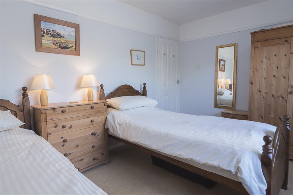 Twin room with 3' wooden framed single beds