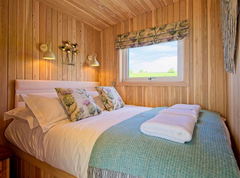 Bedroom with kingsize bed at Little Beach, 