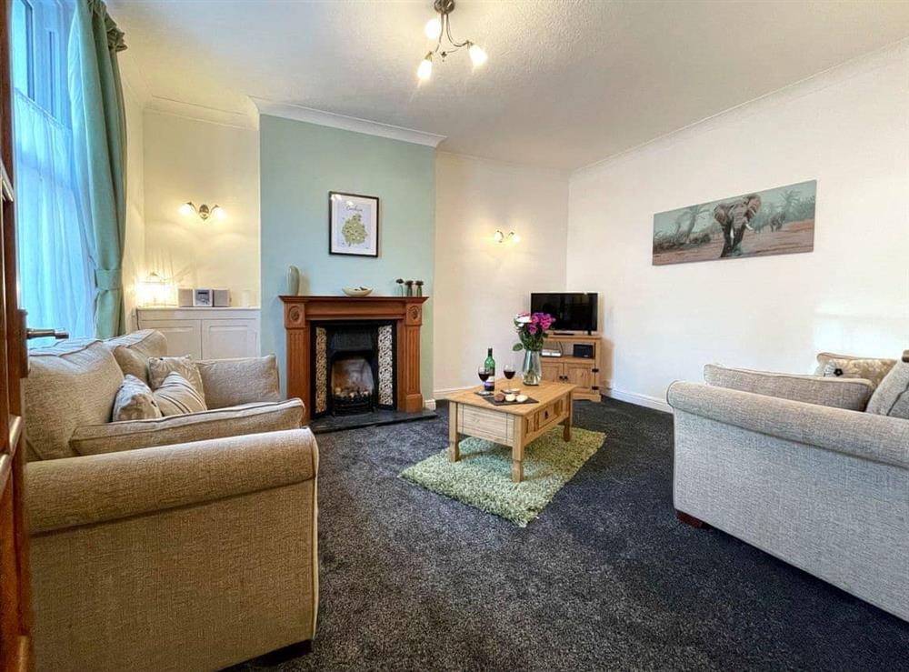 Comfortable living room with an open fireplace (photo 3) at Baree in Keswick, Cumbria