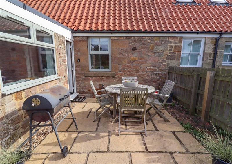 Enjoy a cup of tea on the patio at Barleycorn Cottage, Belford