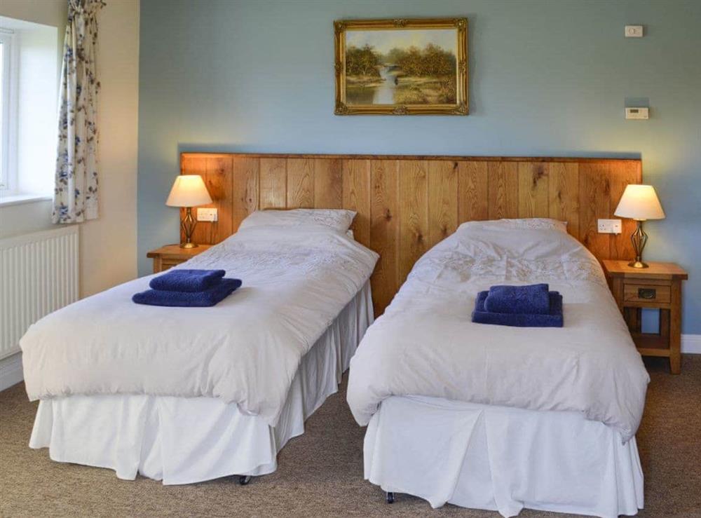 Comfortable bedroom in a twin configuration at Barleycorn in Holnest, near Sherborne, Dorset