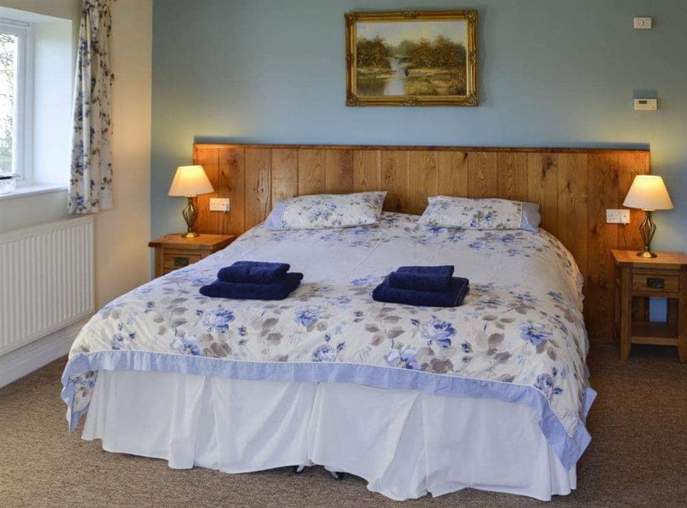Cosy and romantic bedroom comfigured as a double bedroom at Barleycorn in Holnest, near Sherborne, Dorset