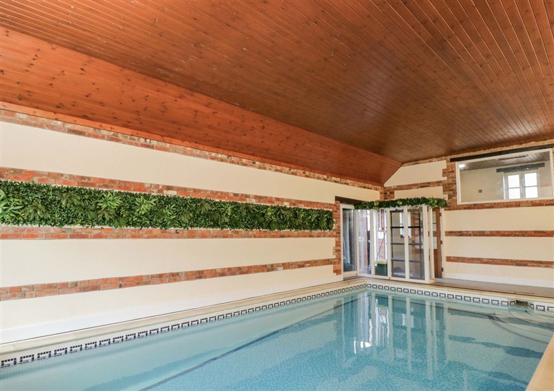 Enjoy the swimming pool at Barn Cottage, Frome