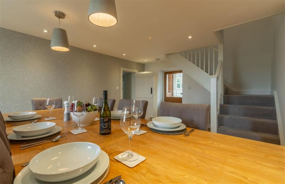 Ground floor: Dining area and stairs to the first floor at Barn Cottage, Salthouse near Holt