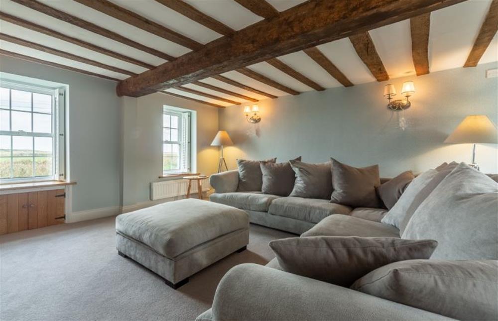 Ground floor: Sitting room with incredible views of the marshes out to sea at Barn Cottage, Salthouse near Holt