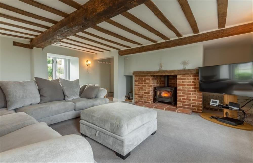 Ground floor: Sitting room with wood burning stove and Smart television at Barn Cottage, Salthouse near Holt