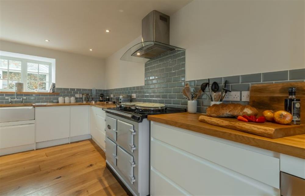 Ground floor: Well-equipped kitchen with Aga, Belfast sink and wine cooler at Barn Cottage, Salthouse near Holt