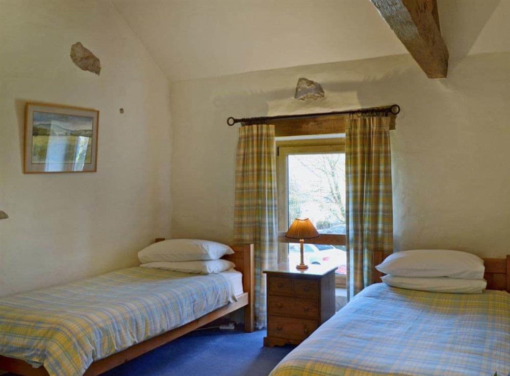 Charming twin bedroom with beams at Barn End Cottage in Blackwell in the Peak, near Buxton, Derbyshire
