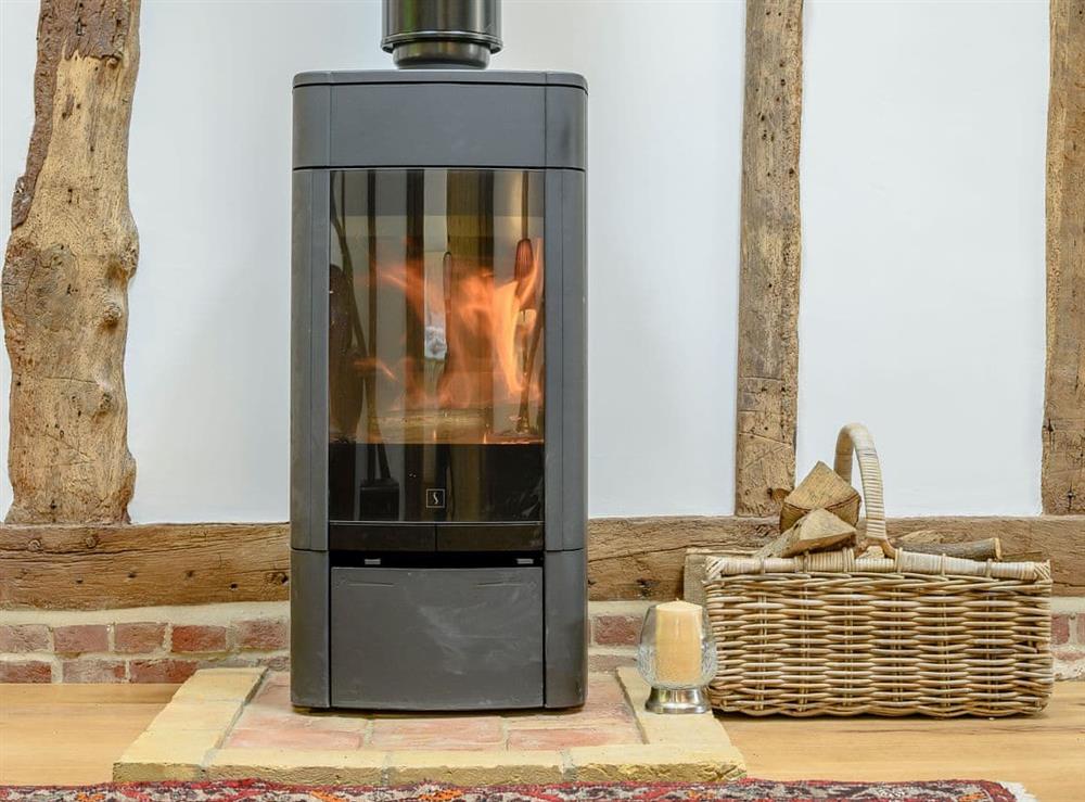 Cosy wood burner at Barn End Cottage in Carlton, near Saxmundham, Suffolk