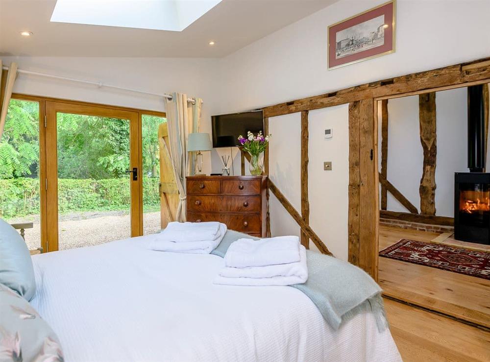 Romantic double bedroom with beams at Barn End Cottage in Carlton, near Saxmundham, Suffolk