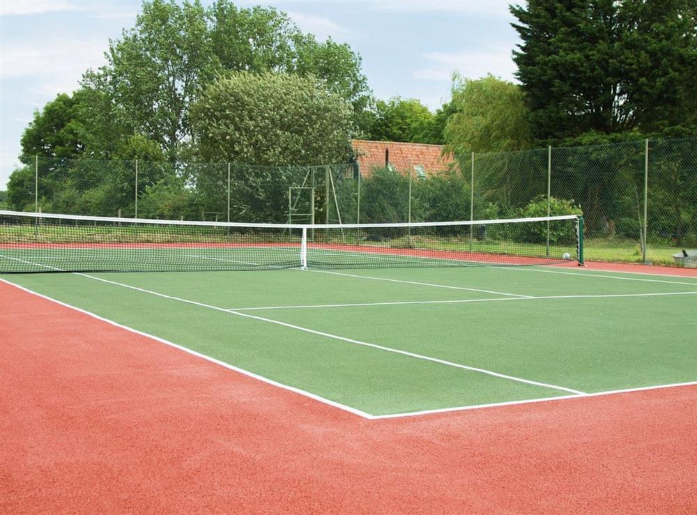 Shared tennis court at Barn End Cottage in Carlton, near Saxmundham, Suffolk