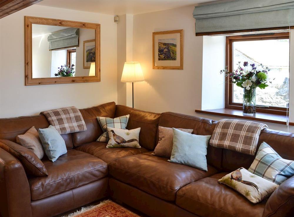Cosy living room at Barn on the Green in Foolow, near Tideswell, Derbyshire, England