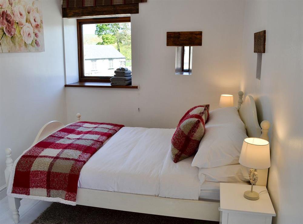 Double bedroom with additional bed at Barn on the Green in Foolow, near Tideswell, Derbyshire, England
