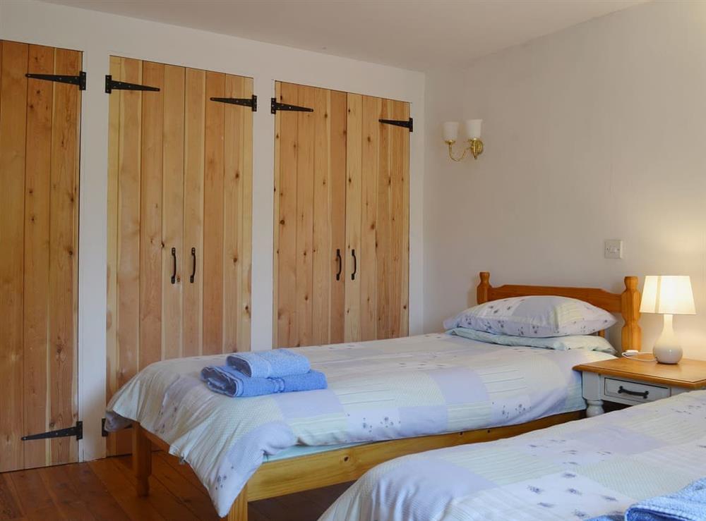 Twin bedded room with loads of storage space at Barn Owl Cottage in Matlock, Derbyshire