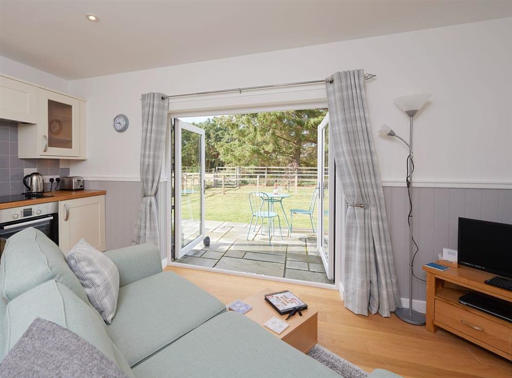 Convenient open-plan design with French doors to garden at Barn Owl Cottage in Newton, near Tain, Highlands, Ross-Shire
