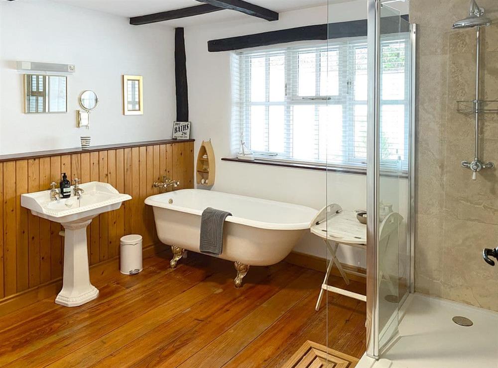 Spacious bathroom with bath and separate walk-in shower at Barnacle in Bucks Mills, near Bideford, Devon
