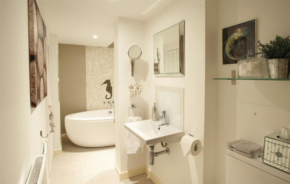En-suite bathroom, large free standing bath, walk in, tiled power shower with heated towel rail at Barnacles, Fowey