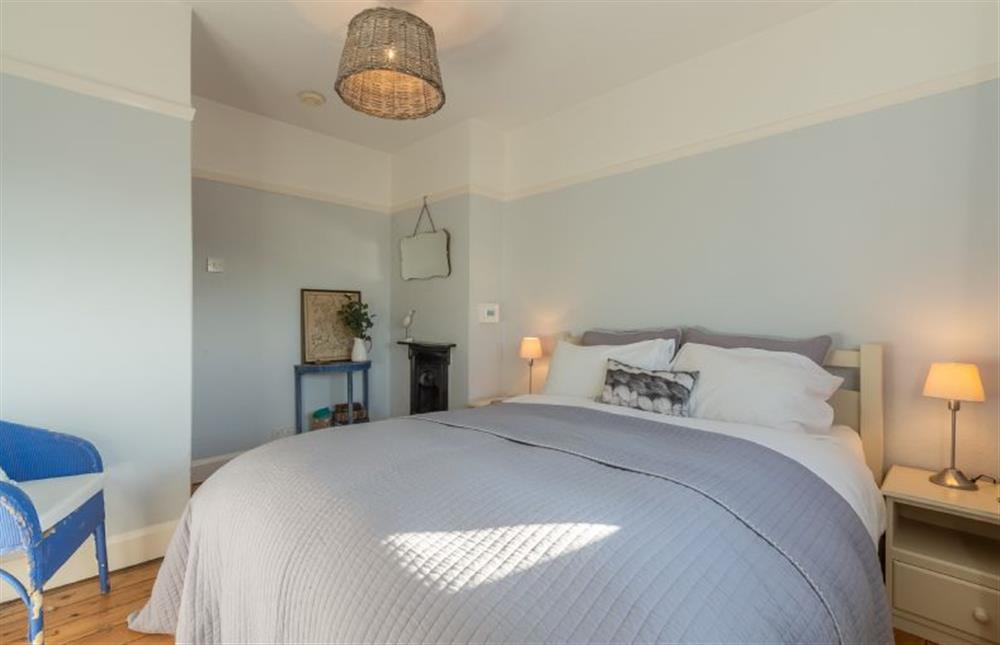 First floor: Master bedroom has feature fireplace at Barnwell Cottage, Holme-next-the-Sea near Hunstanton