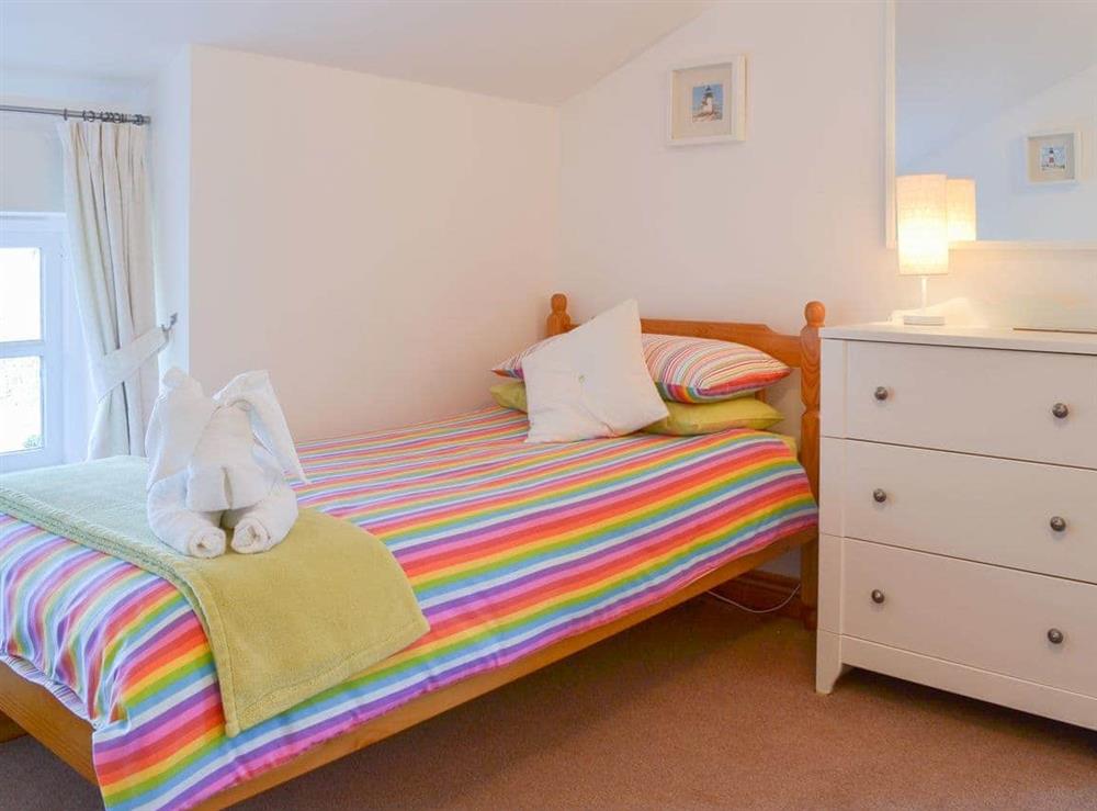Twin bedded room with bright bedding at Barton Cottage in North Petherwin, near Launceston, Cornwall