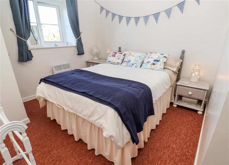 This is a bedroom at Barton Woods Cottage, Kenegie Manor Holiday Park near Penzance