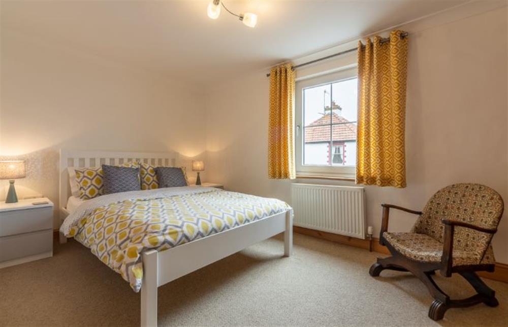 First floor: Master bedroom at Basil Cottage, Wells-next-the-Sea