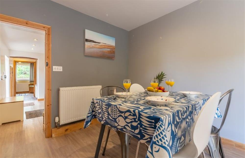 Ground floor: Dining area through to the kitchen  at Basil Cottage, Wells-next-the-Sea