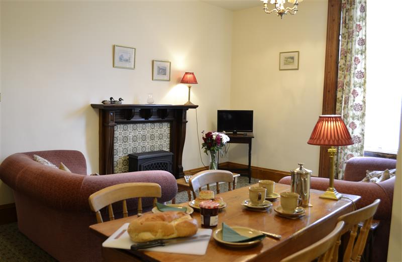 Relax in the living area at Bassett Apartment, Berrynarbor near Ilfracombe