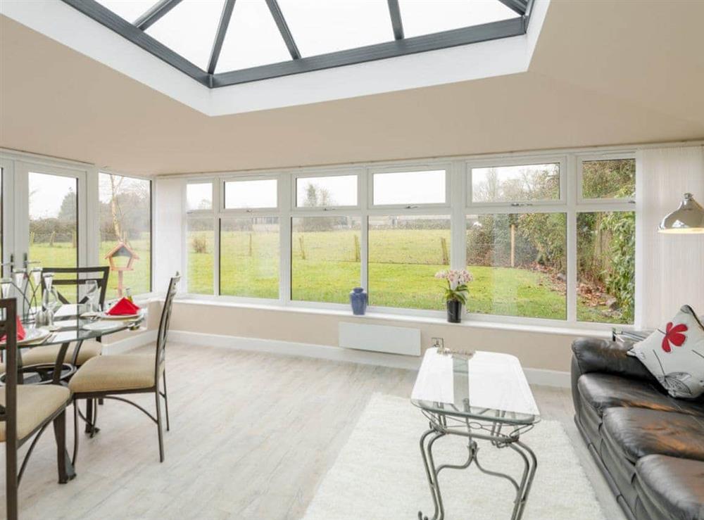 Light and airy conservatory/ dining area (photo 2) at Bay Cottage in Boughton, near Downham Market, Norfolk