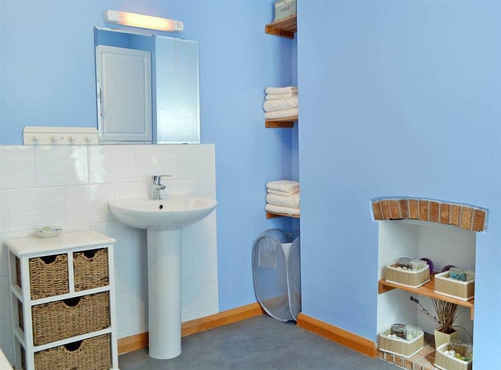 Bathroom with shower over bath at Bay Cottage in Keswick, Cumbria