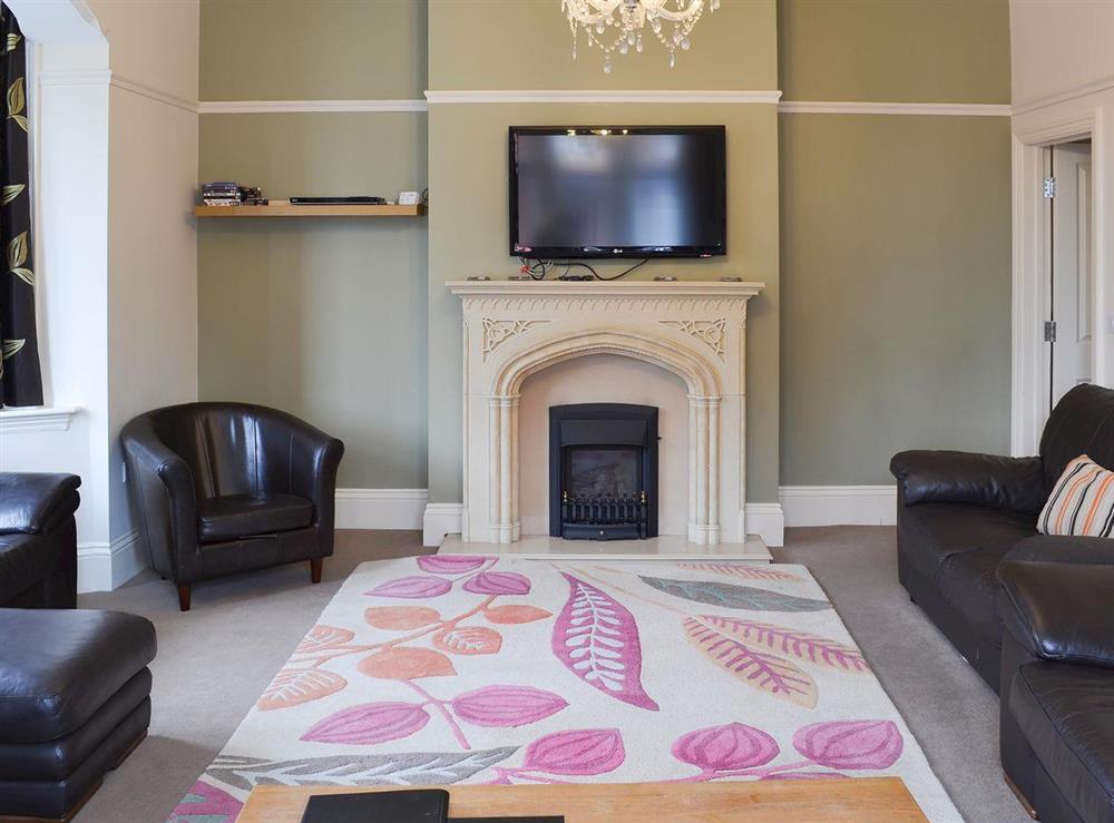 Splendid living room with feature fireplace at Bay House in Filey, North Yorkshire
