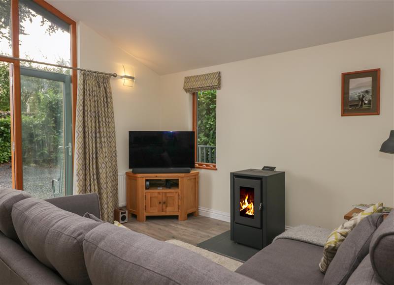 Relax in the living area at Bay Tree Lodge, Cartmel