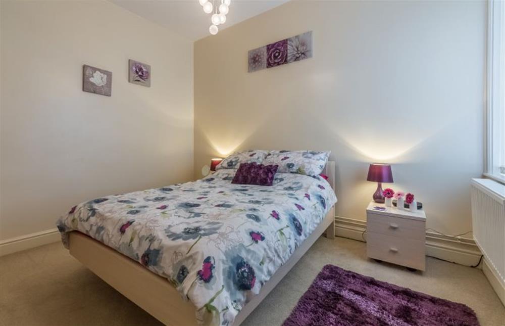 Ground floor: Bedroom one with double bed at Bay View Apartment, Hunstanton