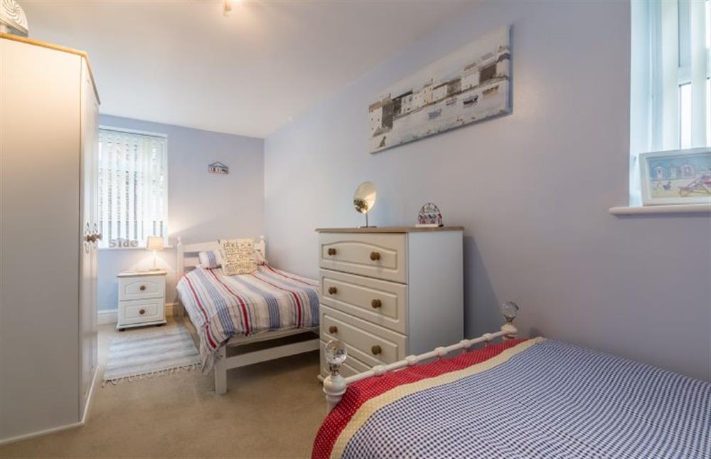 Ground floor: Bedroom two has three full size single beds (photo 3) at Bay View Apartment, Hunstanton