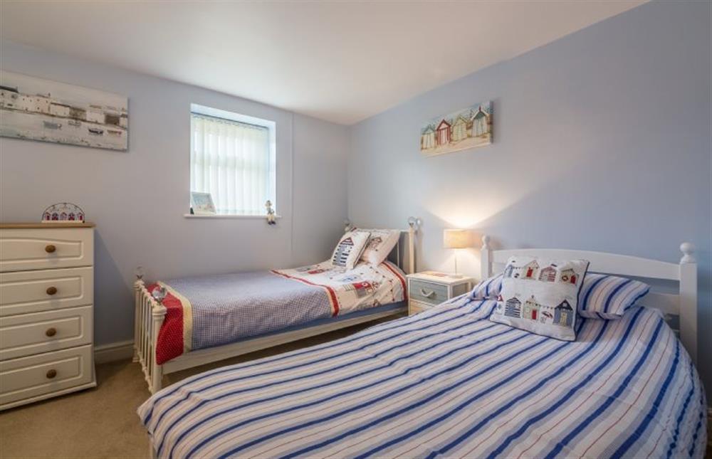 Ground floor: Bedroom two has three full size single beds at Bay View Apartment, Hunstanton