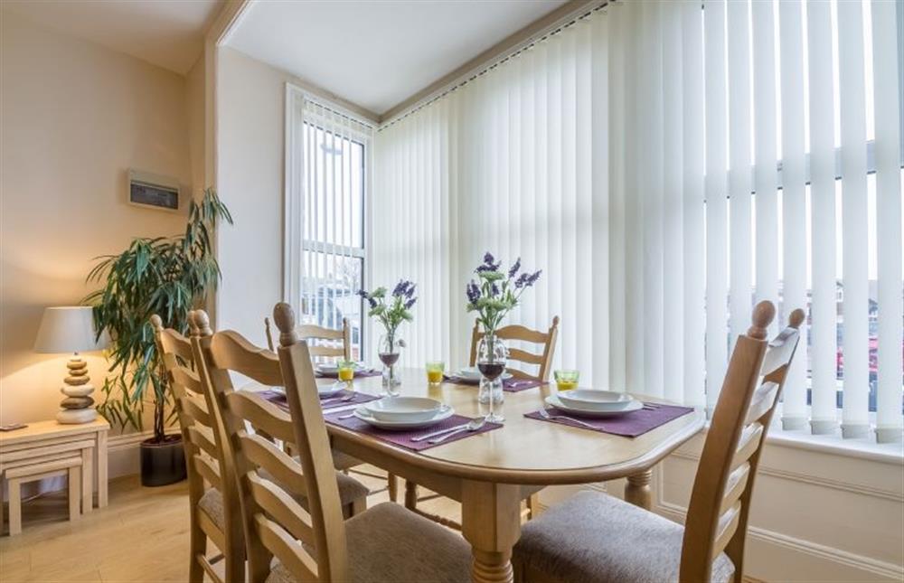 Ground floor: Dining table in the bay window at Bay View Apartment, Hunstanton
