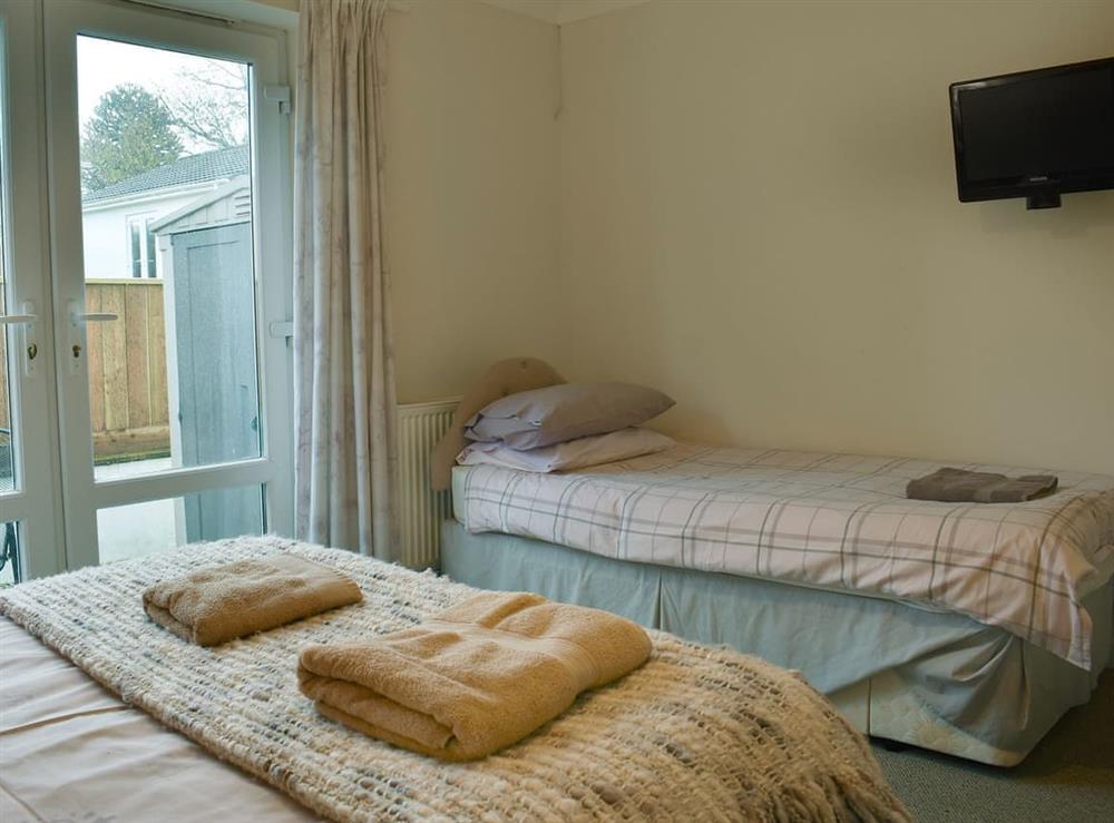 Comfortable bedroom with double bed and single bed (photo 2) at Bay View West Wing in Carlyon Bay, near St Austell, Cornwall