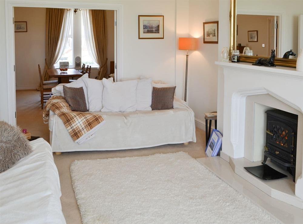 Living room with double doors to the dining room at Bay View in Whitley Bay, Tyne and Wear