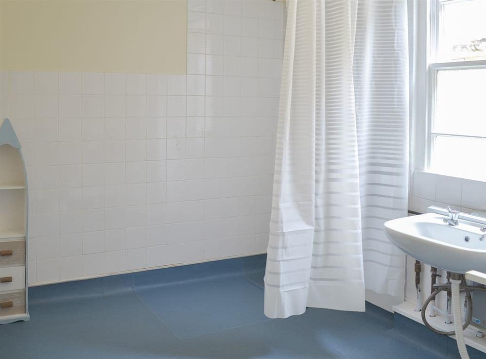 Wet room with shower and washbasin at Baytree House in Torquay, Devon