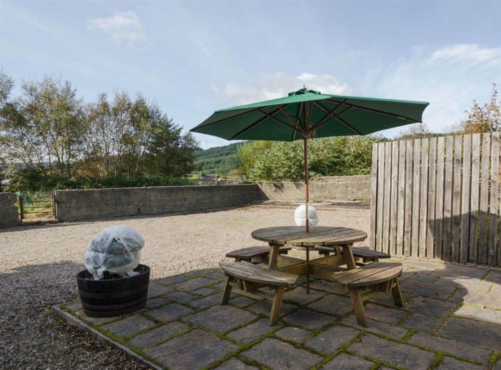 Enclosed rear courtyard with patio and furniture (photo 2) at Bayview in Carradale, Argyll., Great Britain