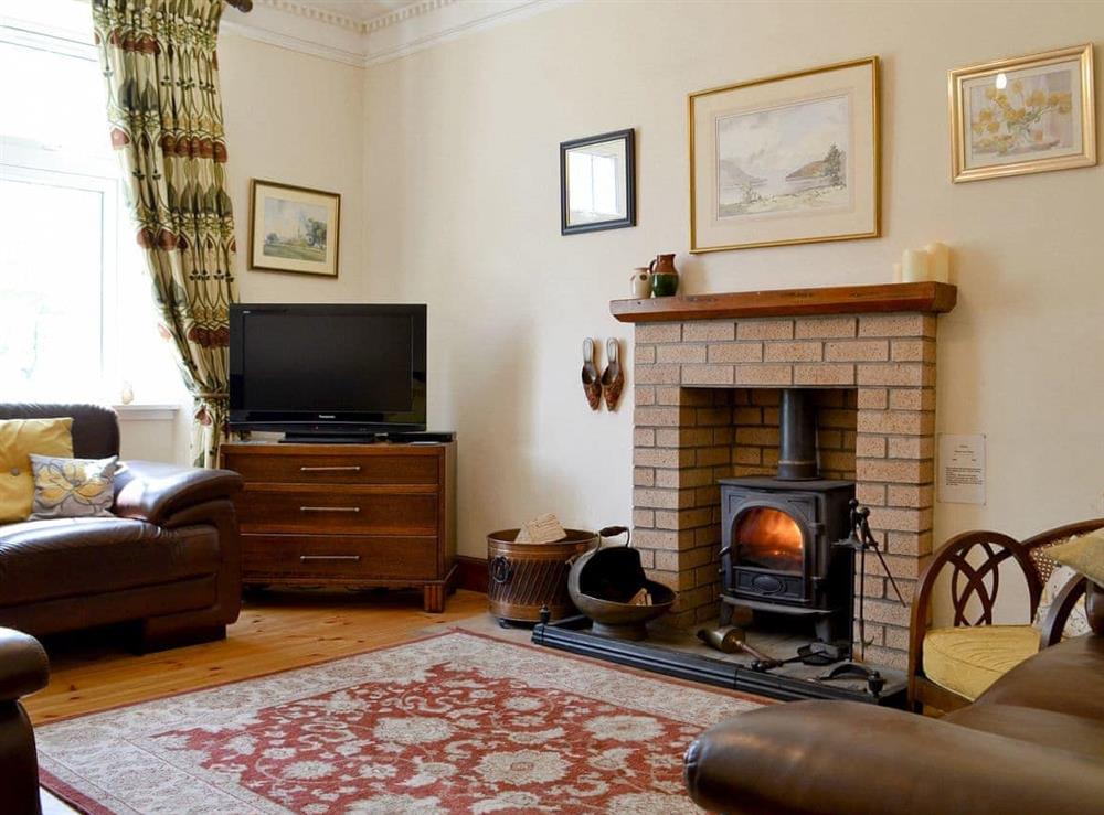 Welcoming living room with multi-fuel stove at Bayview in Carradale, Argyll., Great Britain