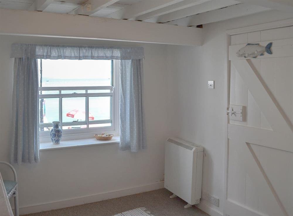 Beamed double bedroom with views out to sea at Beach Corner Cottage in Gorran Haven, near St Austell, Cornwall